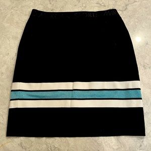 Black stretchy mini skirt, never worn. Stripe detail. Size 6.